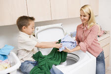 bigstock-Mother-And-Son-Doing-Laundry-5123213